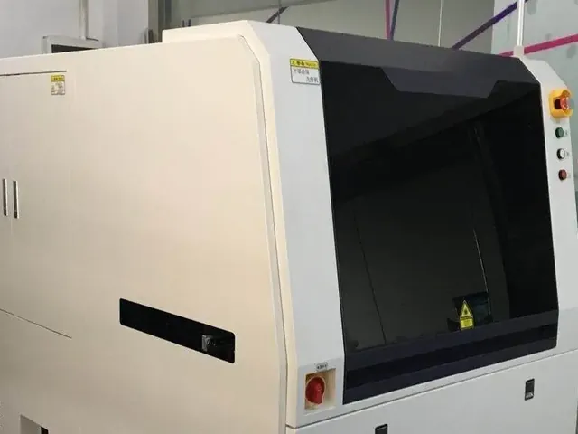 Automated optical inspection machine scanning a circuit board
