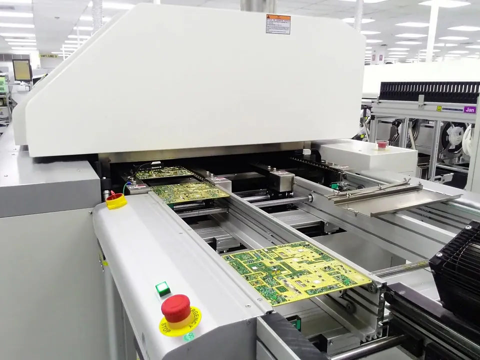 SMT assembly line running populated circuit boards
